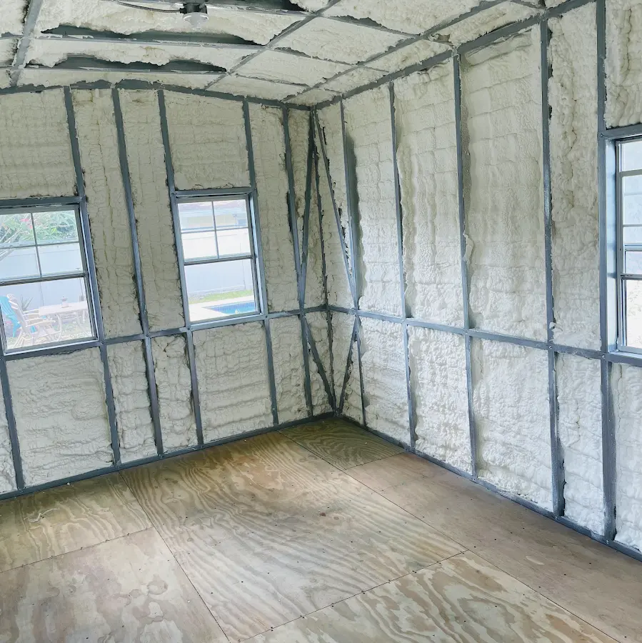 Closed-cell spray foam insulation applied to wall cavities in a residential project in Ishpeming